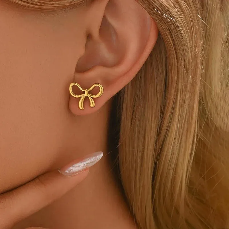 Niyanara Gold Plated Anti Tarnish Bow Themed Stud Earrings