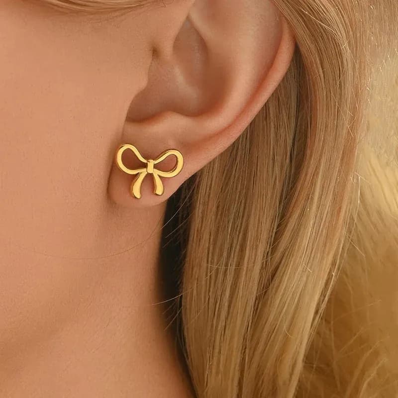 Niyanara Gold Plated Anti Tarnish Bow Themed Stud Earrings